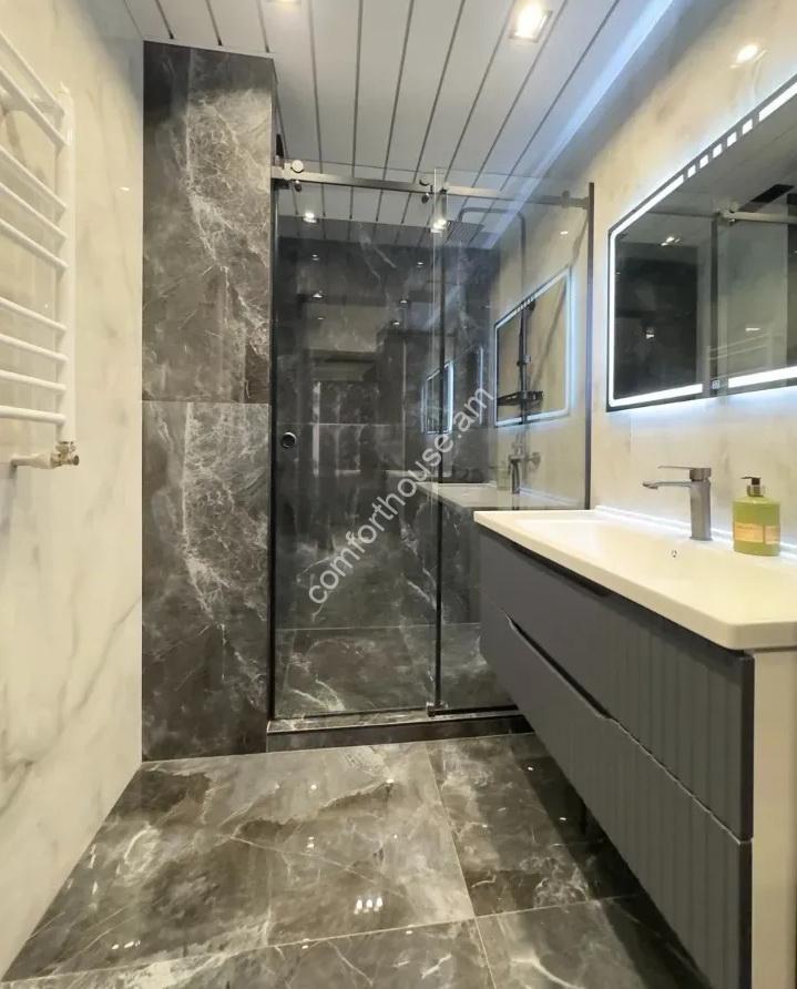 99077700